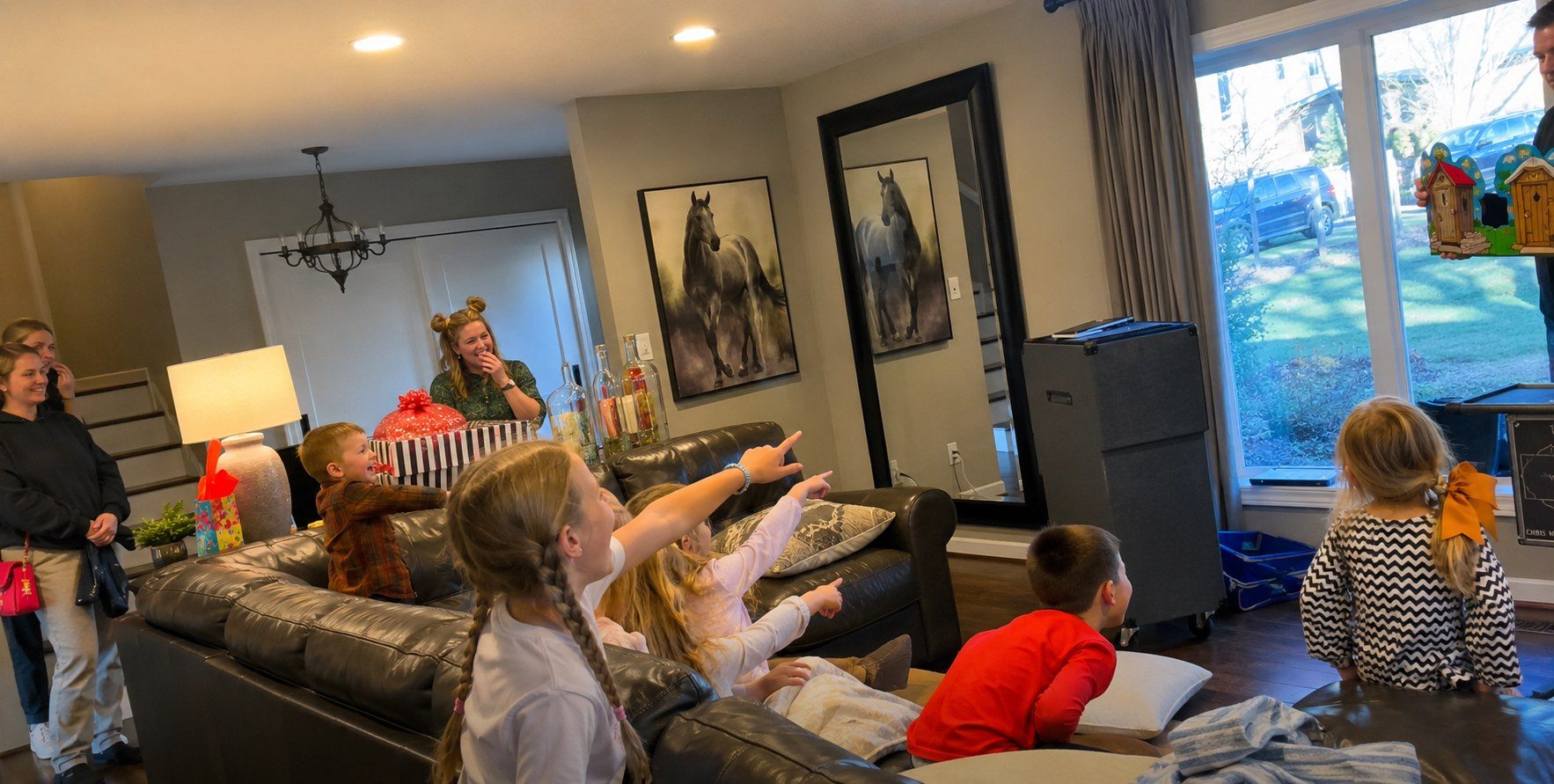 Children pointing and laughing during a private birthday magic show
